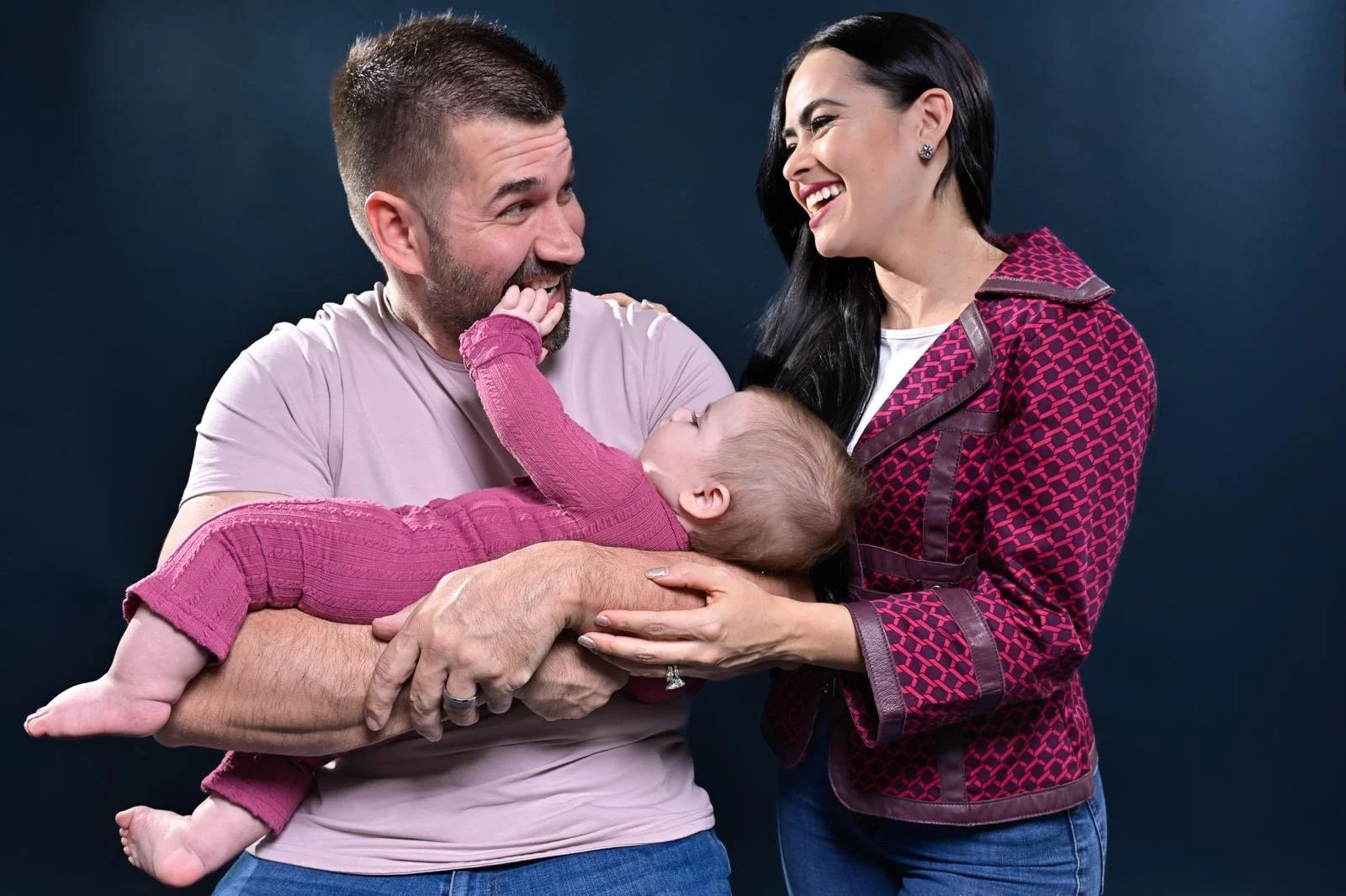 Manny Kess with his wife and their child